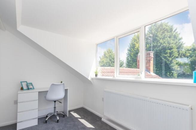 Bright and inviting double bedroom featuring la...