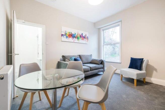 This inviting living room offers a cozy atmosph...