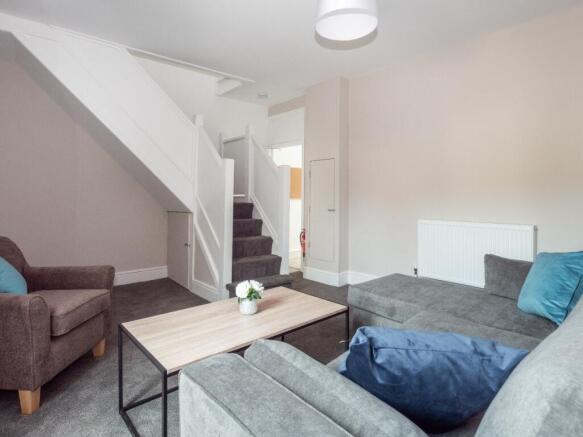 A cozy and inviting living room featuring comfo...