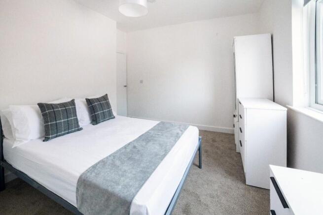 A beautifully presented double bedroom featurin...