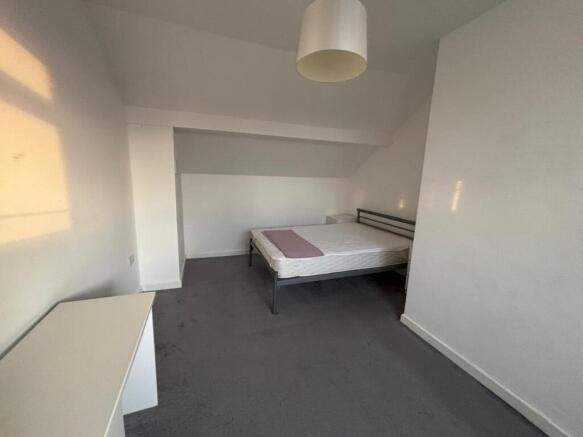 Bright and inviting double bedroom featuring am...