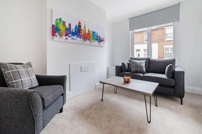 A bright and inviting living room featuring mod...