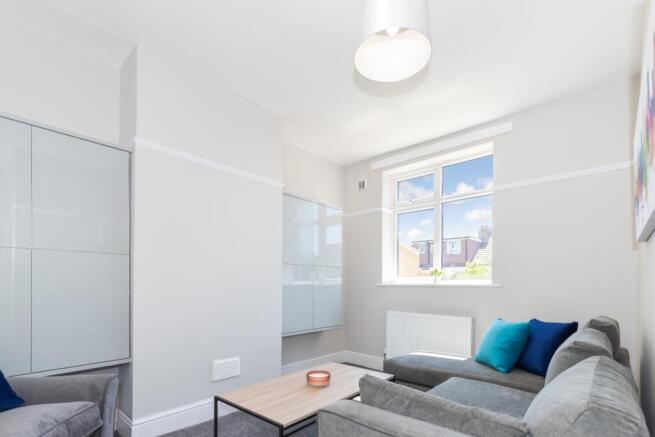 A bright and inviting living room featuring mod...
