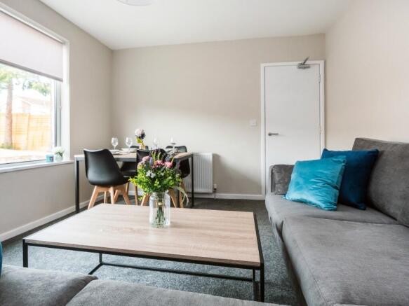 This inviting living room features a comfortabl...