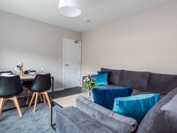 A stylish and inviting living room featuring a ...