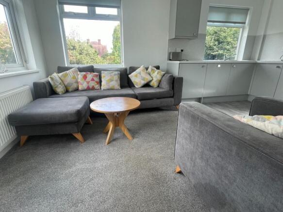 This inviting living room features ample seatin...