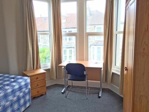 Bright and inviting double bedroom featuring la...