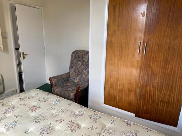 A cozy double bedroom featuring a comfortable b...