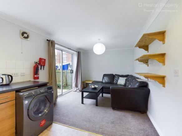 This inviting living room features ample natura...