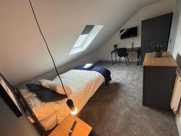 Charming double bedroom featuring a cozy layout...