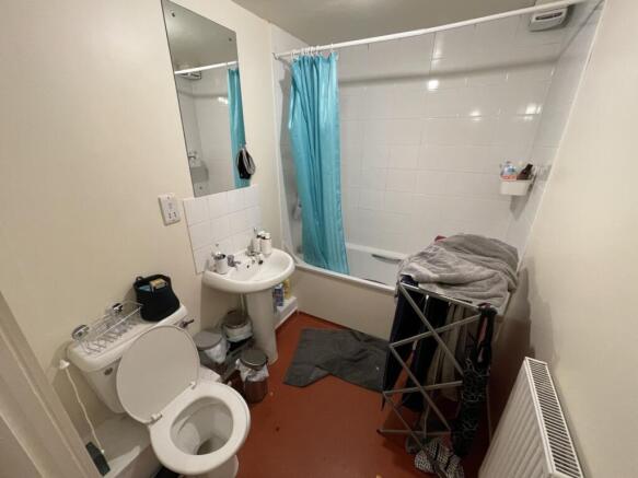 A clean and functional bathroom suite featuring...
