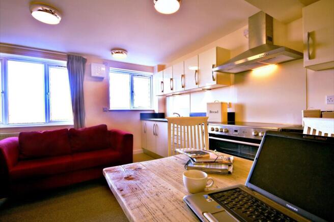 Bright and inviting living room featuring a com...