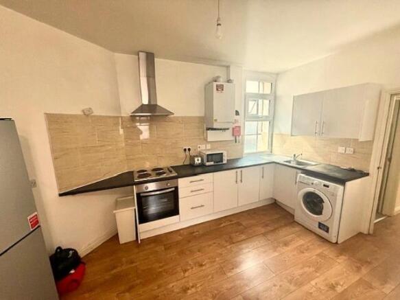 Bright and modern kitchen featuring ample count...