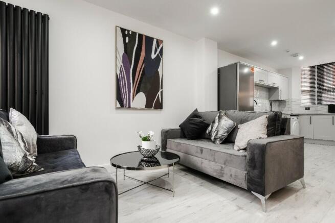 A stylish and modern living room featuring comf...