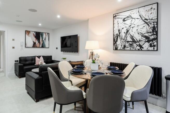 A stylish and modern living room featuring comf...