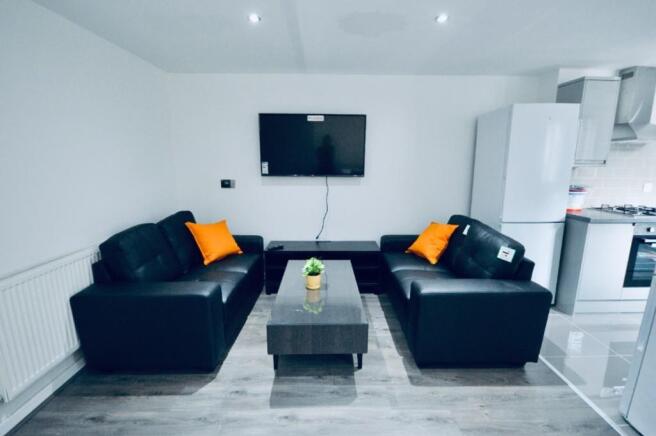 A spacious and inviting modern living room with...