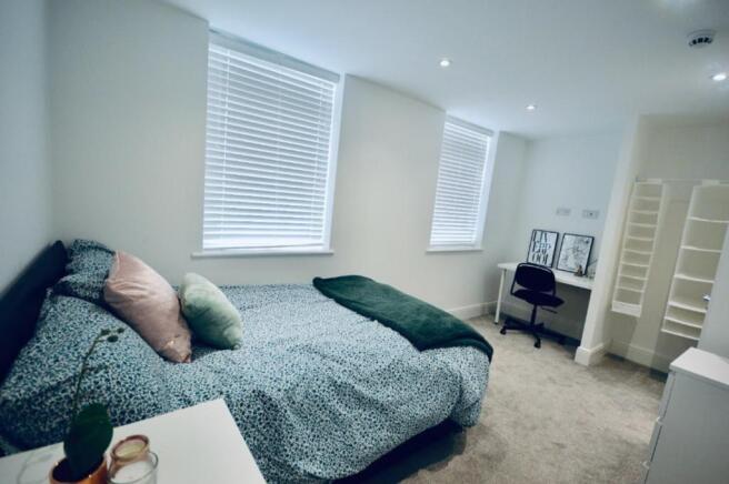 A beautifully presented double bedroom featurin...