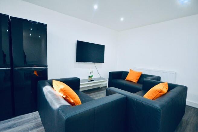 This contemporary living room features modern s...