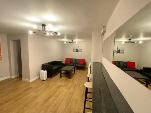 A spacious and inviting modern living room, per...