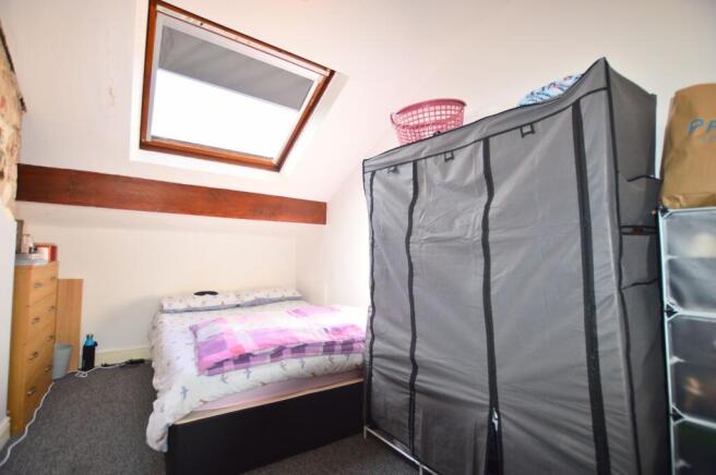 A cozy double bedroom featuring a comfortable d...