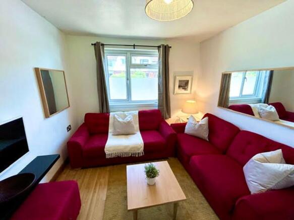 This inviting living room features a cozy arran...
