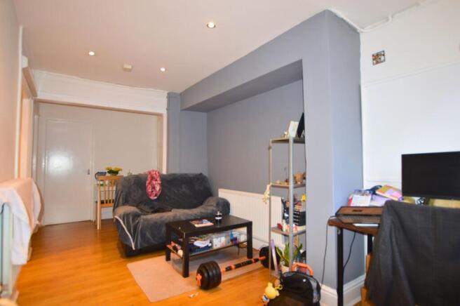 A cozy living room featuring a comfortable sofa...