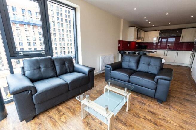 A bright and spacious modern living room featur...