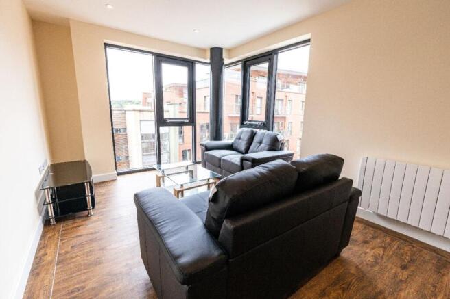 A spacious and bright modern living room with l...