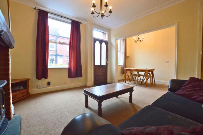 A warm and inviting living room featuring a coz...