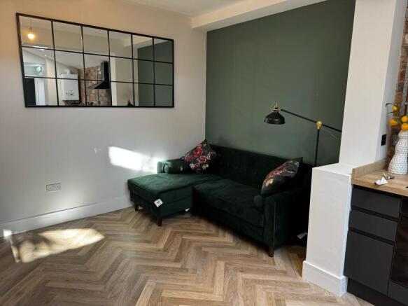 A modern living room featuring a stylish dark g...