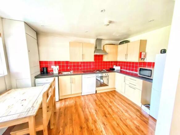 Bright and spacious kitchen featuring modern li...