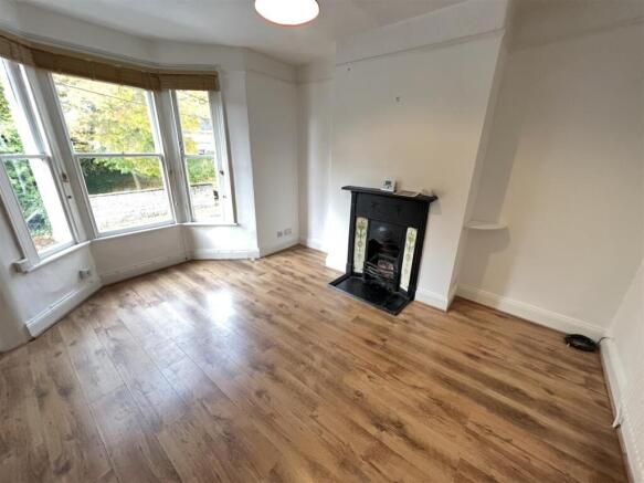 Spacious and bright living room featuring a lar...