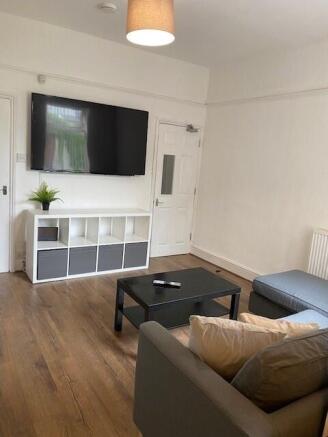 Spacious living room featuring modern furnishin...