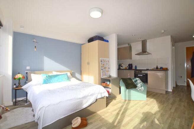 Bright and inviting master bedroom with a cozy ...