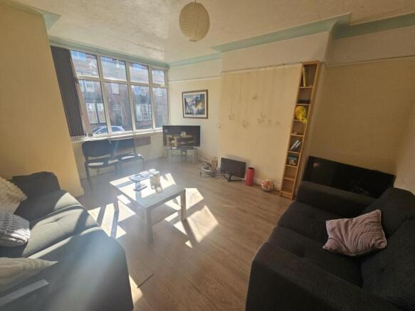Bright and inviting living room featuring ample...