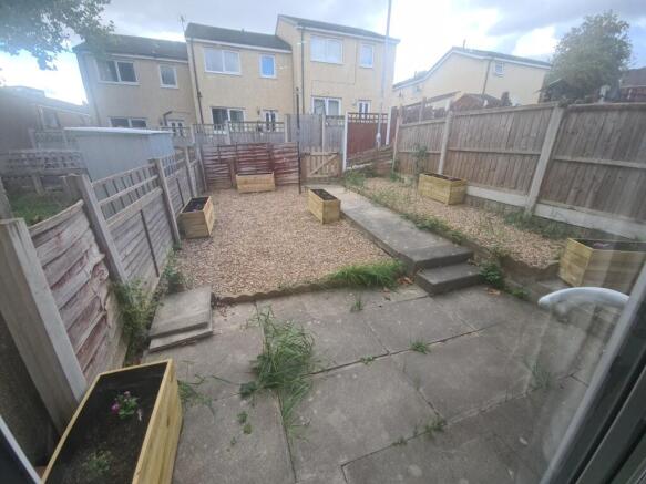 A private, well-maintained garden space with a ...