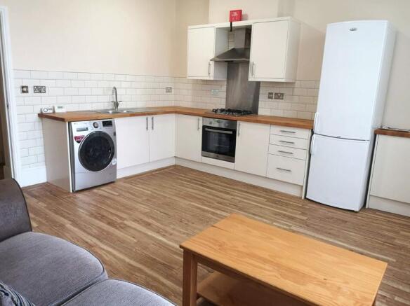 Bright and modern kitchen with ample countertop...