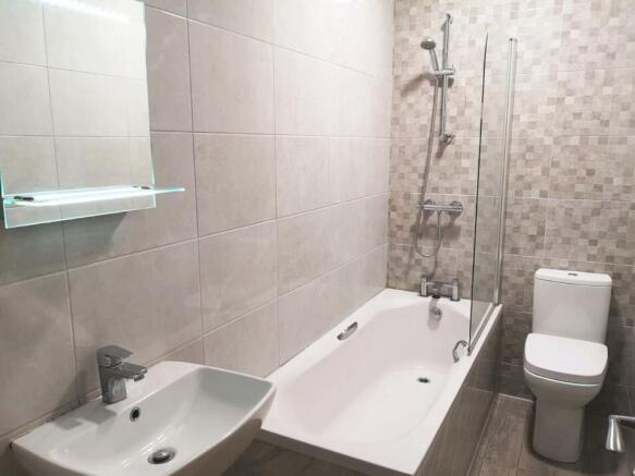 A modern and neatly maintained bathroom featuri...