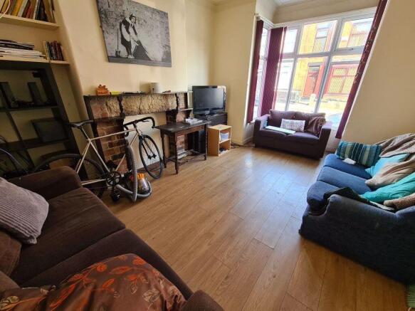 Bright and welcoming living room featuring larg...