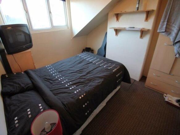 Cozy double bedroom featuring a comfortable dou...