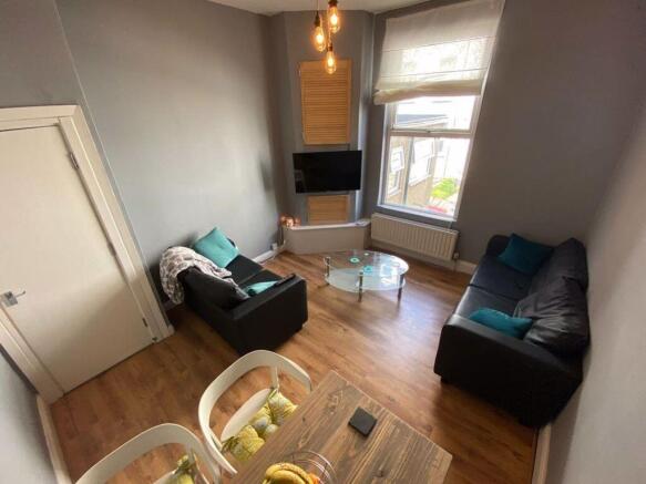 Bright and cozy living room featuring modern fu...