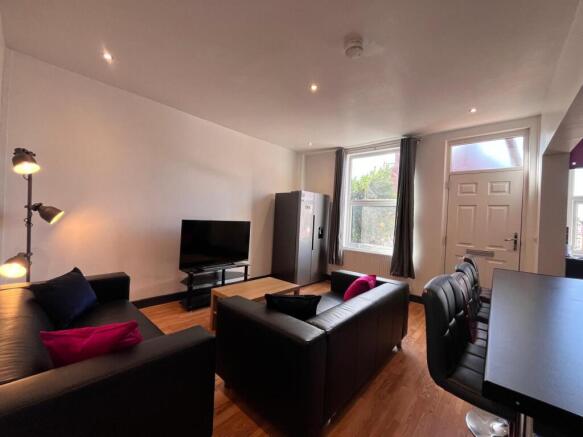 A modern and cozy living room featuring comfort...