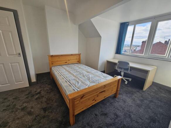 Bright and inviting master bedroom featuring a ...
