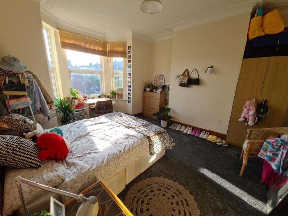 Bright and inviting master bedroom featuring a ...
