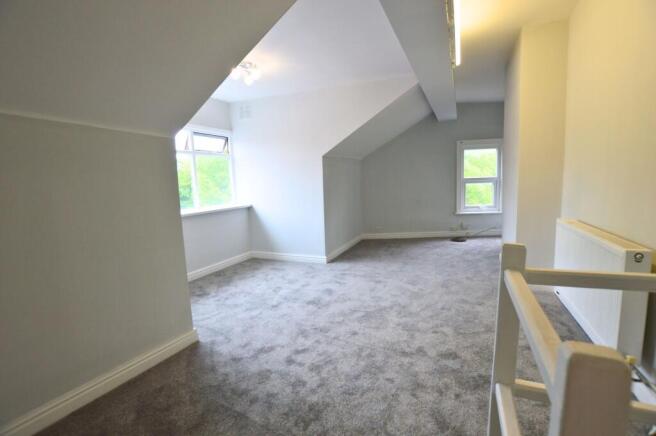 Bright and spacious master bedroom featuring fr...