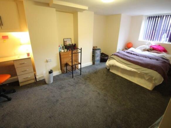 Spacious and well-maintained bedroom featuring ...