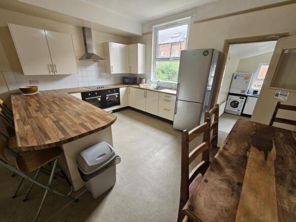 Bright and well-maintained kitchen featuring mo...