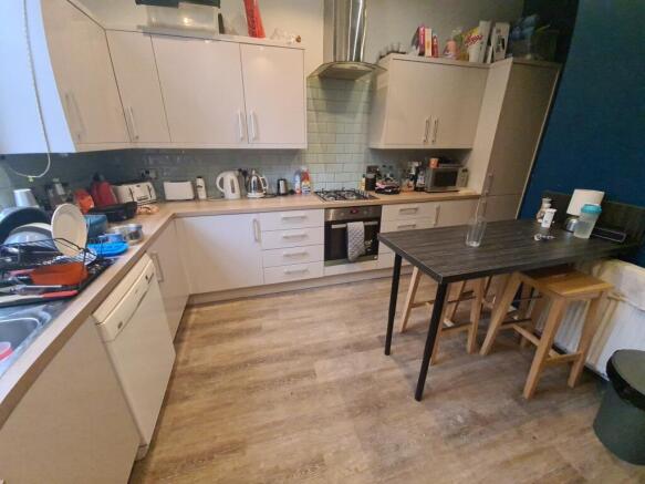 A well-equipped kitchen featuring modern applia...