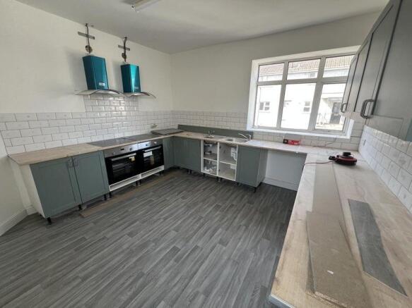 Bright and spacious kitchen featuring modern ca...