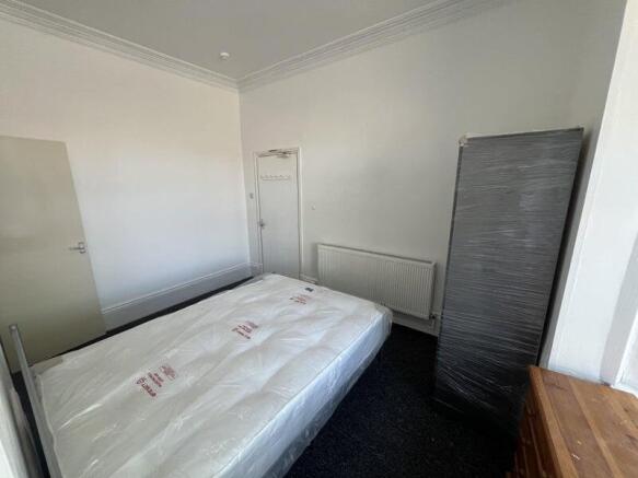 Bright and tidy double bedroom featuring a larg...